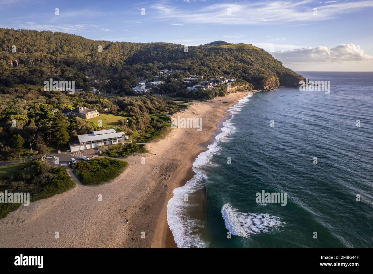 A Drone shot over green Stanwell park beach on a sunny day Stock Photo