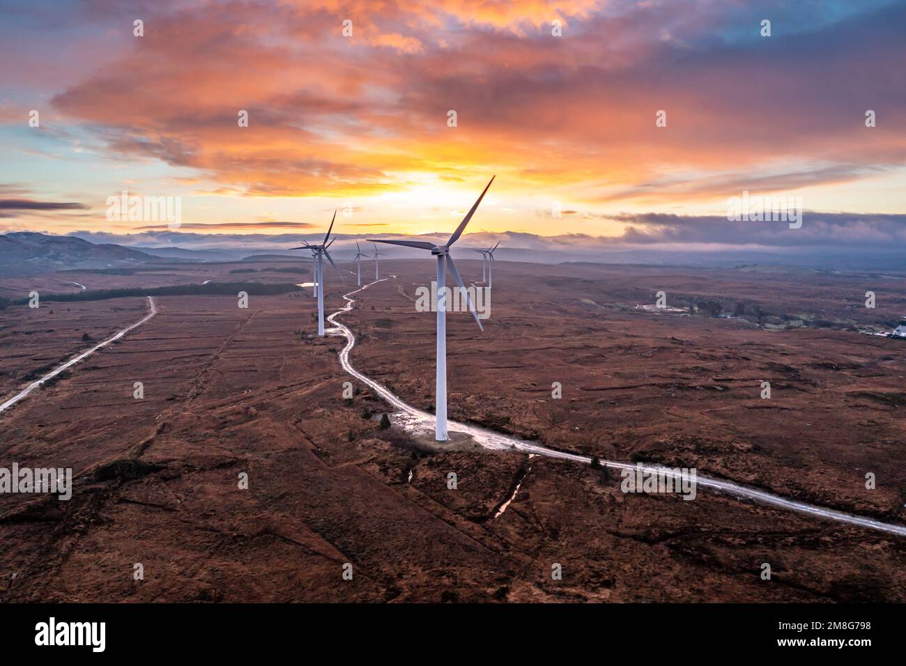 Amazing sunrise at the Loughderryduff windfarm between Ardara and Portnoo in County Donegal, Ireland. Stock Photo
