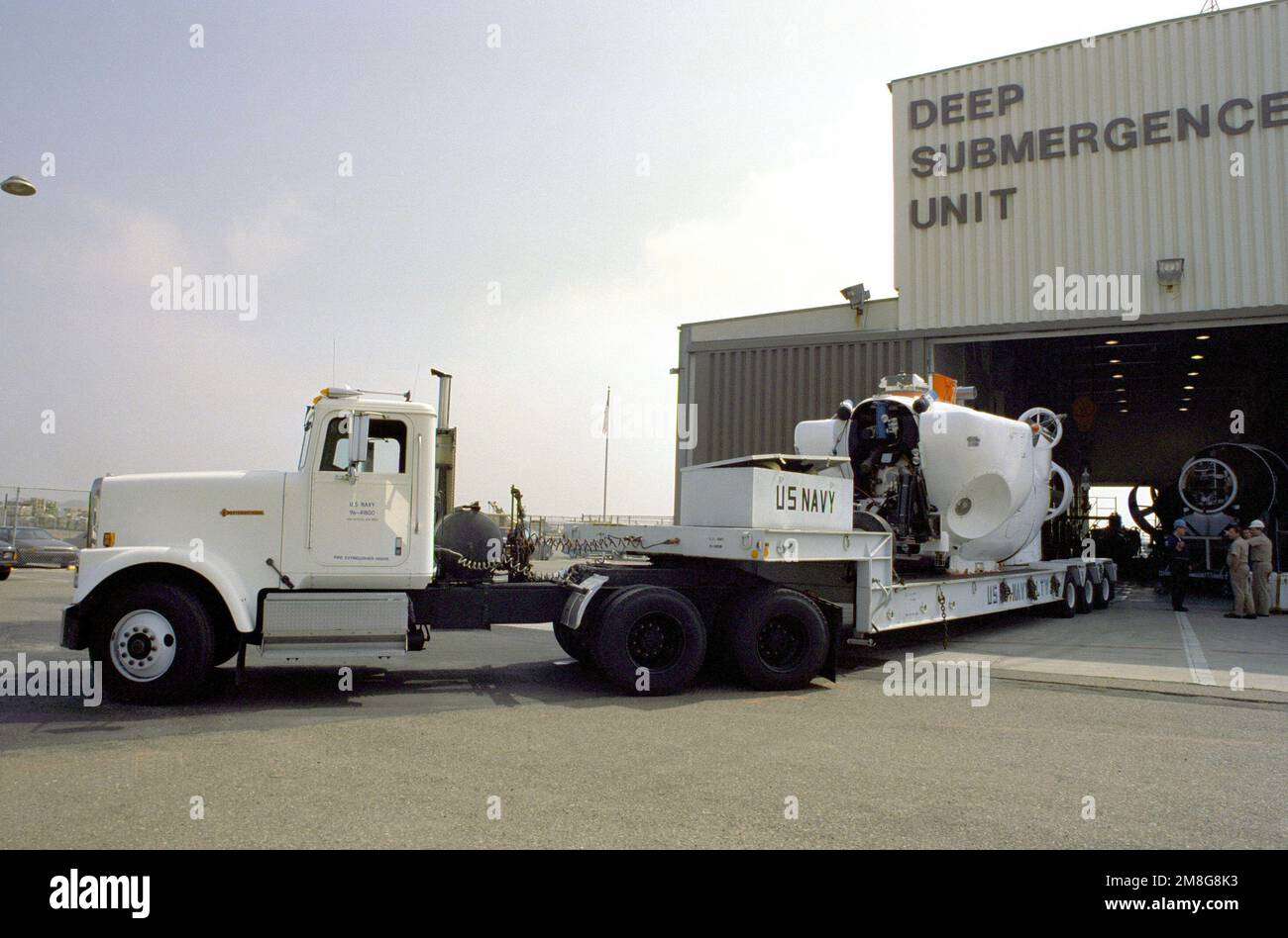 A Navy tractor trailer transport the deep submergence vehicle Turtle (DSV-3) from the Deep Submergence Unit to a launch site. Base: San Diego State: California(CA) Country: United States Of America (USA) Stock Photo