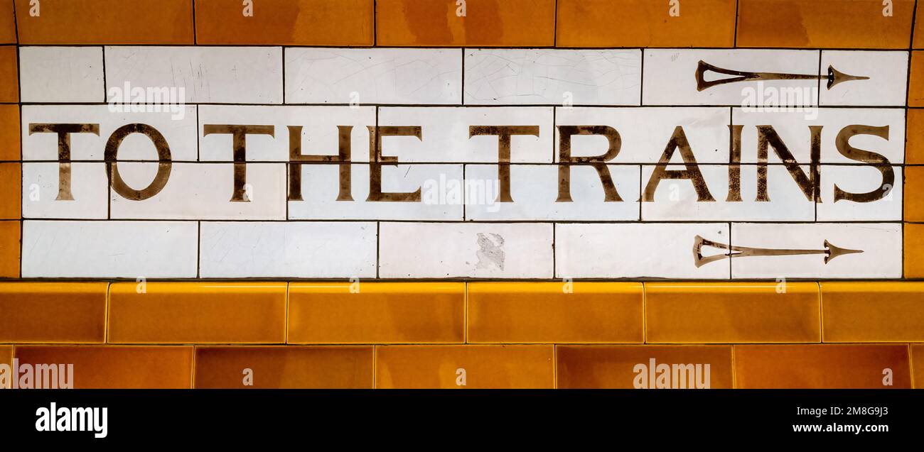 London, UK - 5th January 2023: Art deco To The Trains tiled sign at Covent Garden Underground station, which was opened in 1907 and is on the TFL Picc Stock Photo