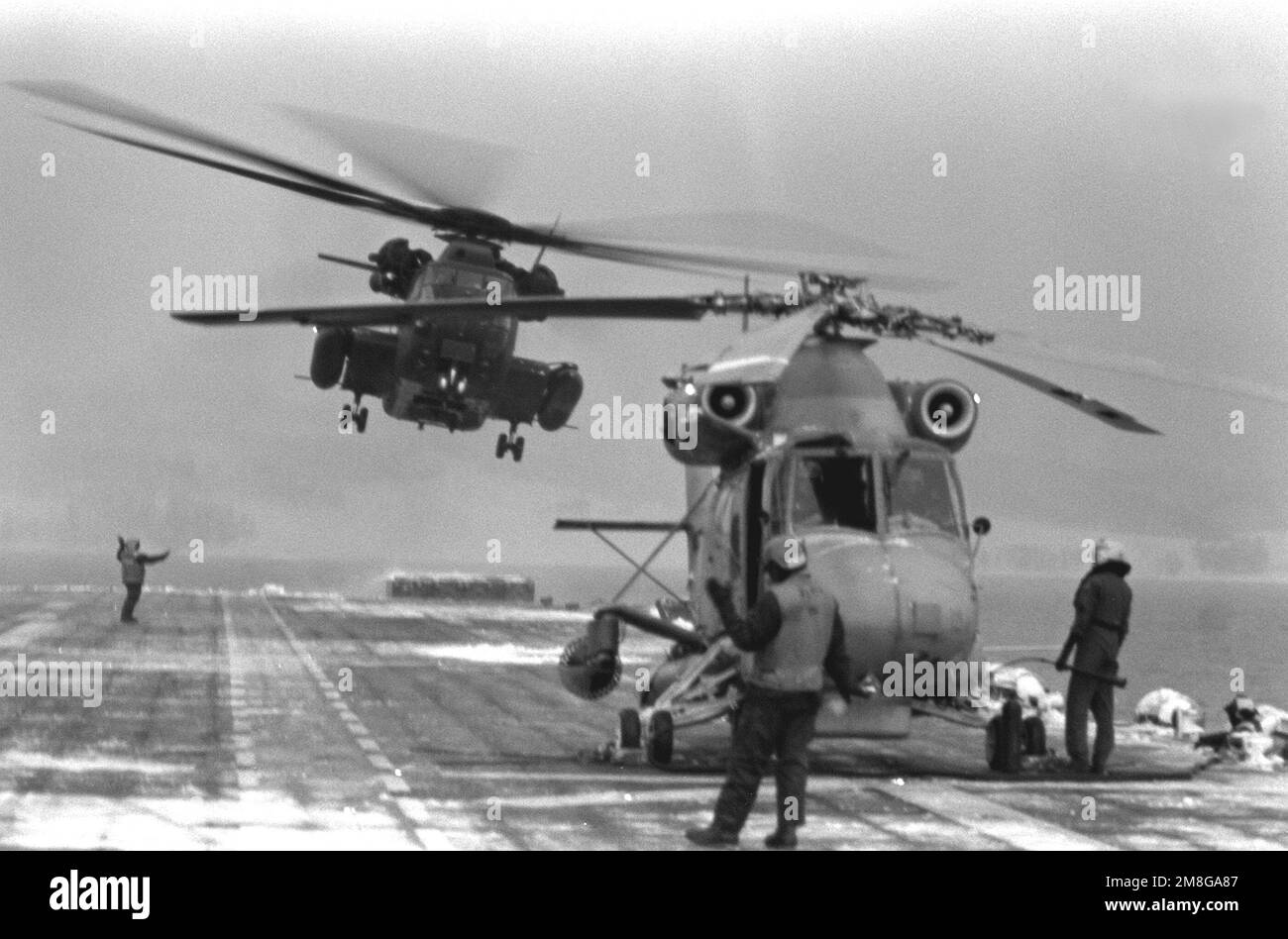 A CH-53E Super Stallion helicopter lifts off from the fantail of the ...