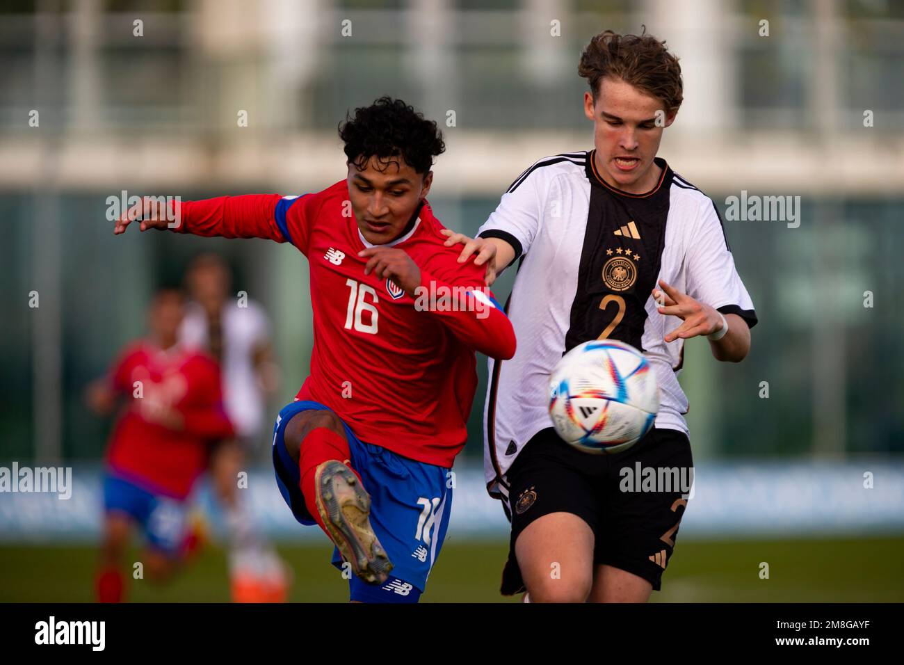 morales-bryan-of-costa-rica-ben-weber-of-germny-they-run-for-the-ball