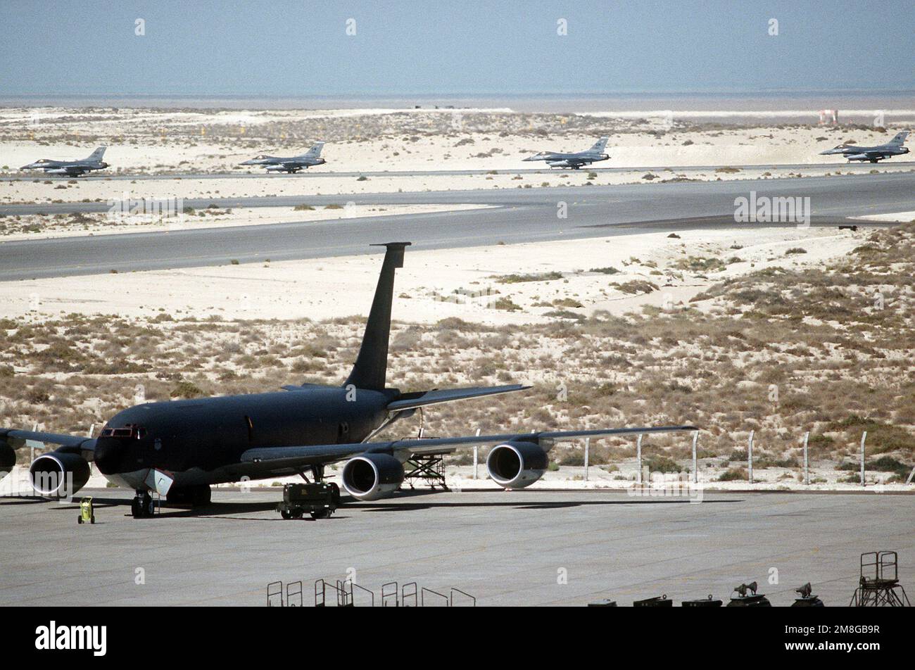 A KC135R Stratotanker aircraft is prepared for a mission as F16