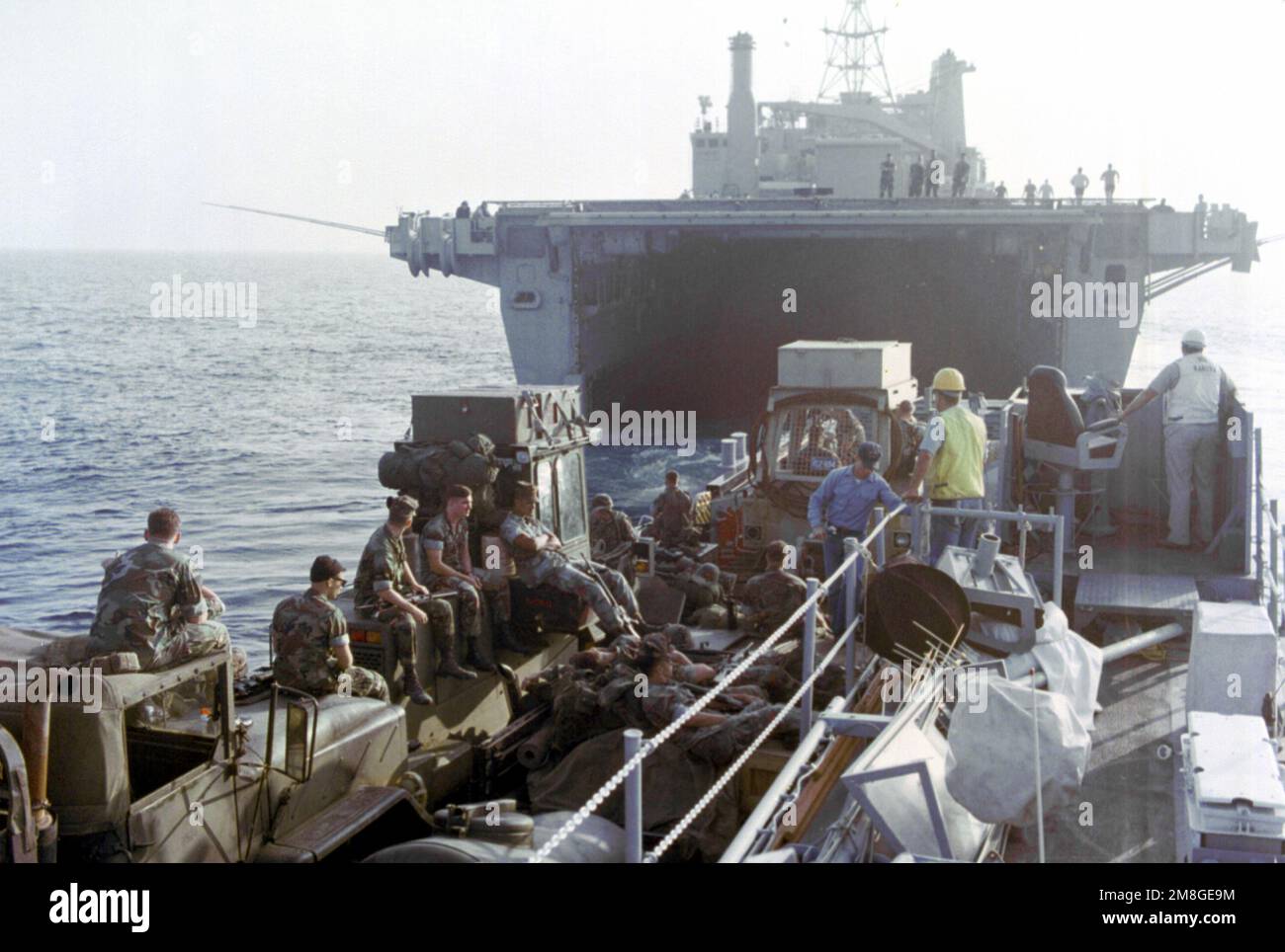 Members of the 24th Marine Expeditionary Unit relax on a utility