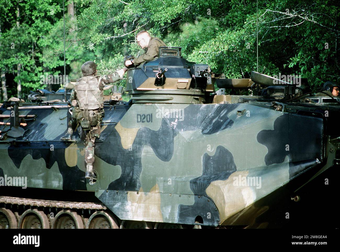 Marines of the 3rd Battalion, Camp Lejeune, N.C., climb into a Marine AAV-7A1 armored assault vehicle in amphibious assault training during a joint military exercise called OCEAN VENTURE '92. Subject Operation/Series: OCEAN VENTURE '92 State: North Carolina(NC) Country: United States Of America (USA) Stock Photo