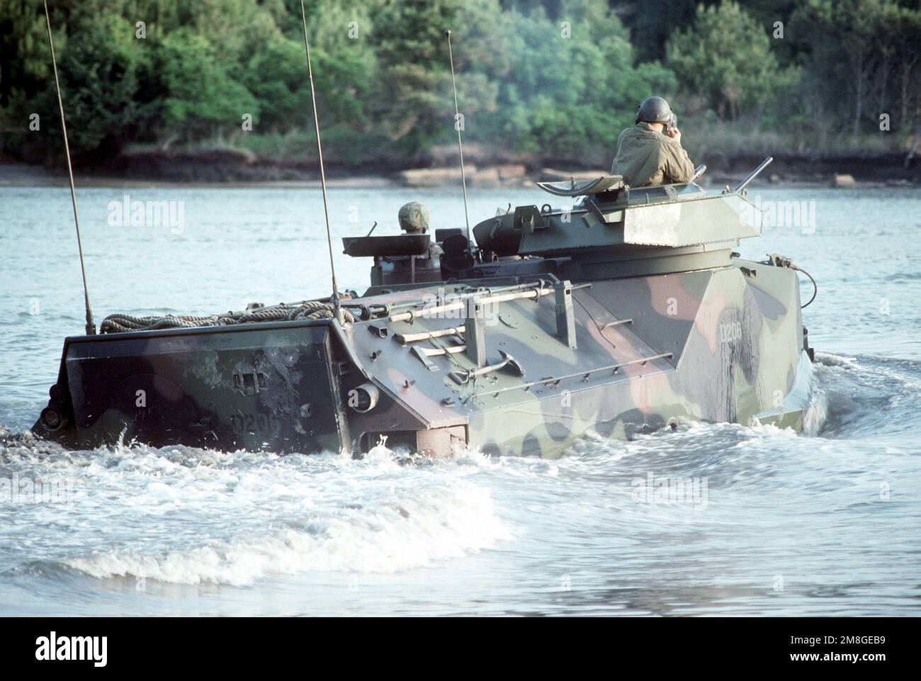 A Marine AAV-7A1 armored assault vehicle makes its way to a beach with Marines of the 3rd Battalion, Camp Lejeune, N.C., as part of a joint military exercise called Ocean Venture '92 off the coast of North Carolina. Subject Operation/Series: OCEAN VENTURE '92 Country: Atlantic Ocean (AOC) Stock Photo