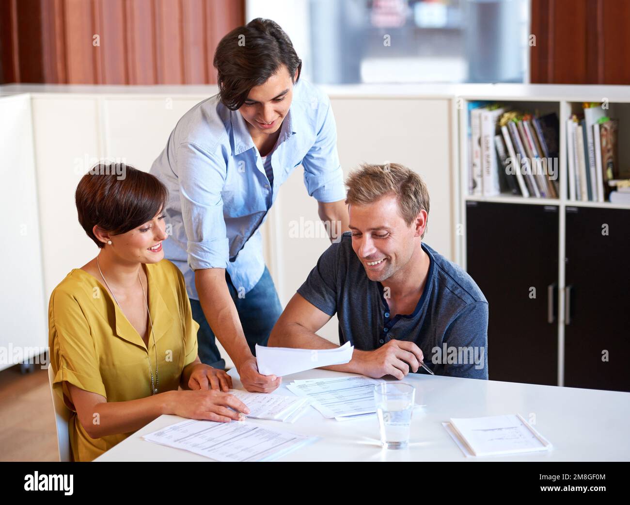 Metting In Process This looks good. a business meeting in progress Stock Photo - Alamy