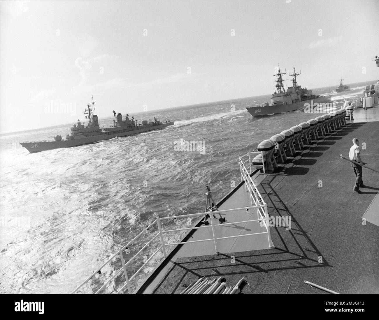 The Australian guided missile destroyer HMAS PERTH (DDG38) leads the