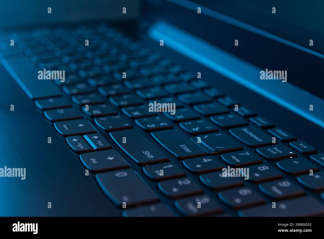 Laptop's Keyboard in the Night. Concept programming and IT industry Stock Photo