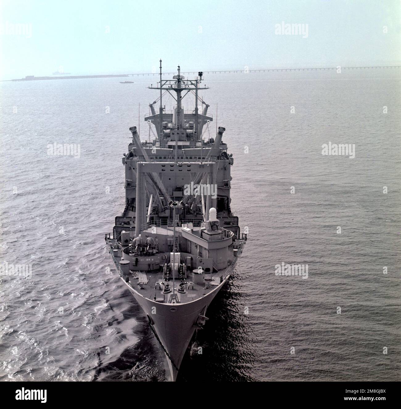 A bow view of the amphibious cargo ship USS EL PASO (LKA117) at anchor