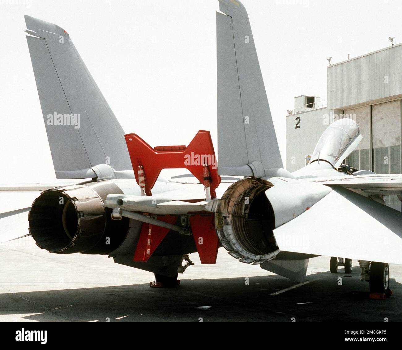 A closeup view of the engine exhaust nozzles of the F110 engines of a