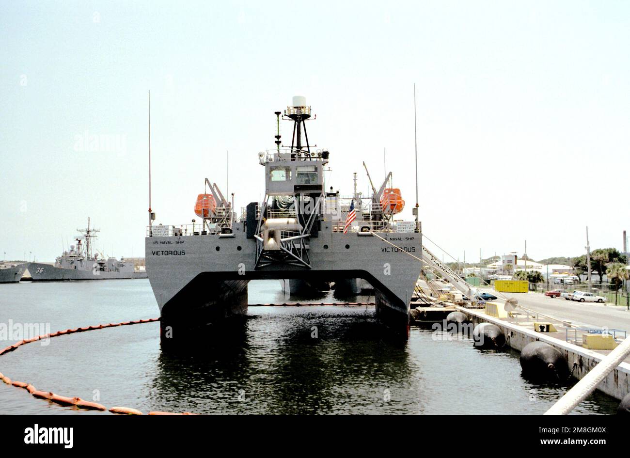 A stern view of the ocean surveillance ship USNS VICTORIOUS (T-AGOS-19) as it stands moored to a pier. Base: Naval Station, Mayport State: Florida(FL) Country: United States Of America (USA) Stock Photo