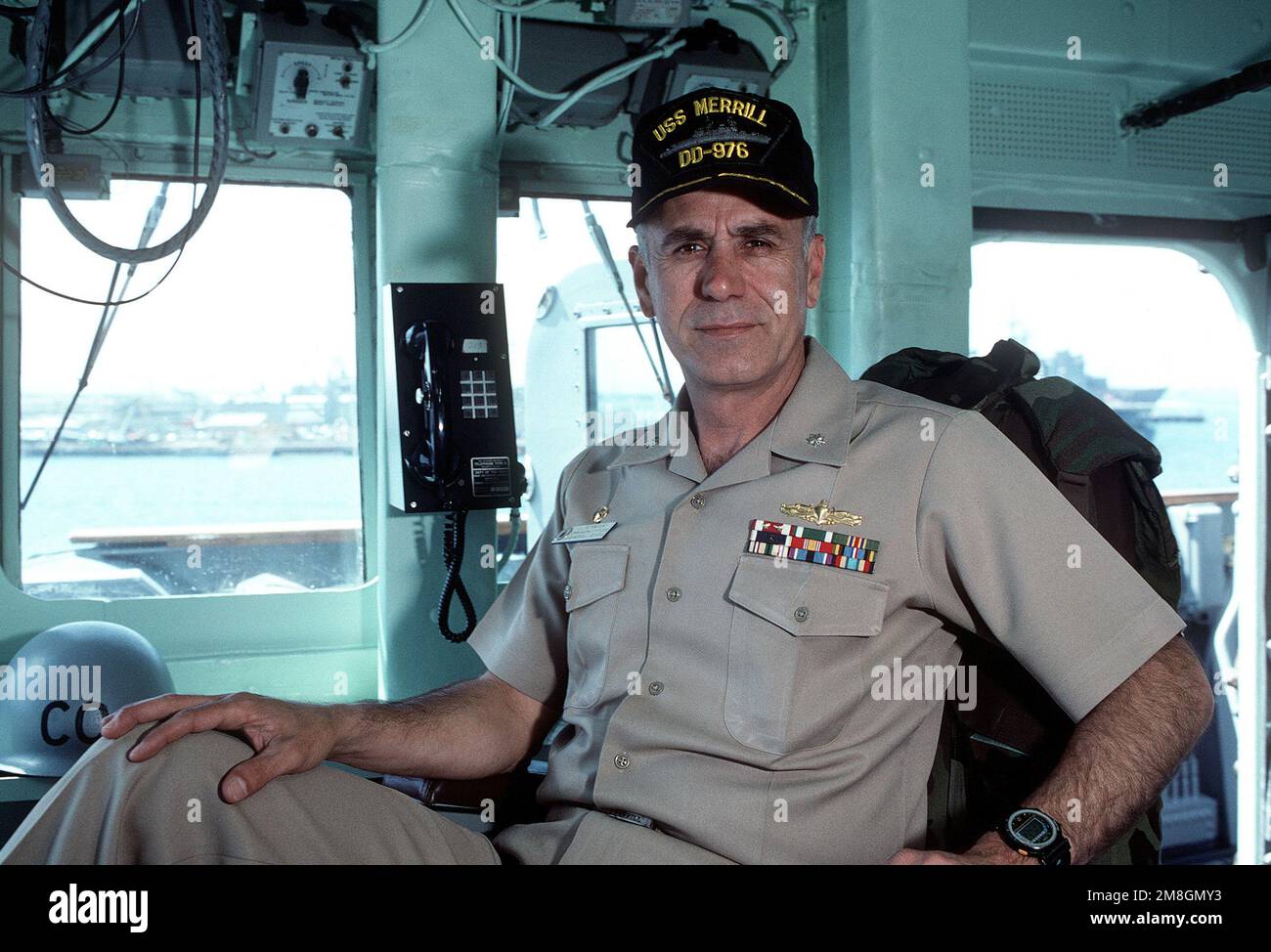 CDR Jose L. Betancourt, commanding officer, poses for a photograph on the bridge of his ship, the destroyer USS MERRILL (DD-976). Base: Naval Air Station, San Diego State: California(CA) Country: United States Of America (USA) Stock Photo