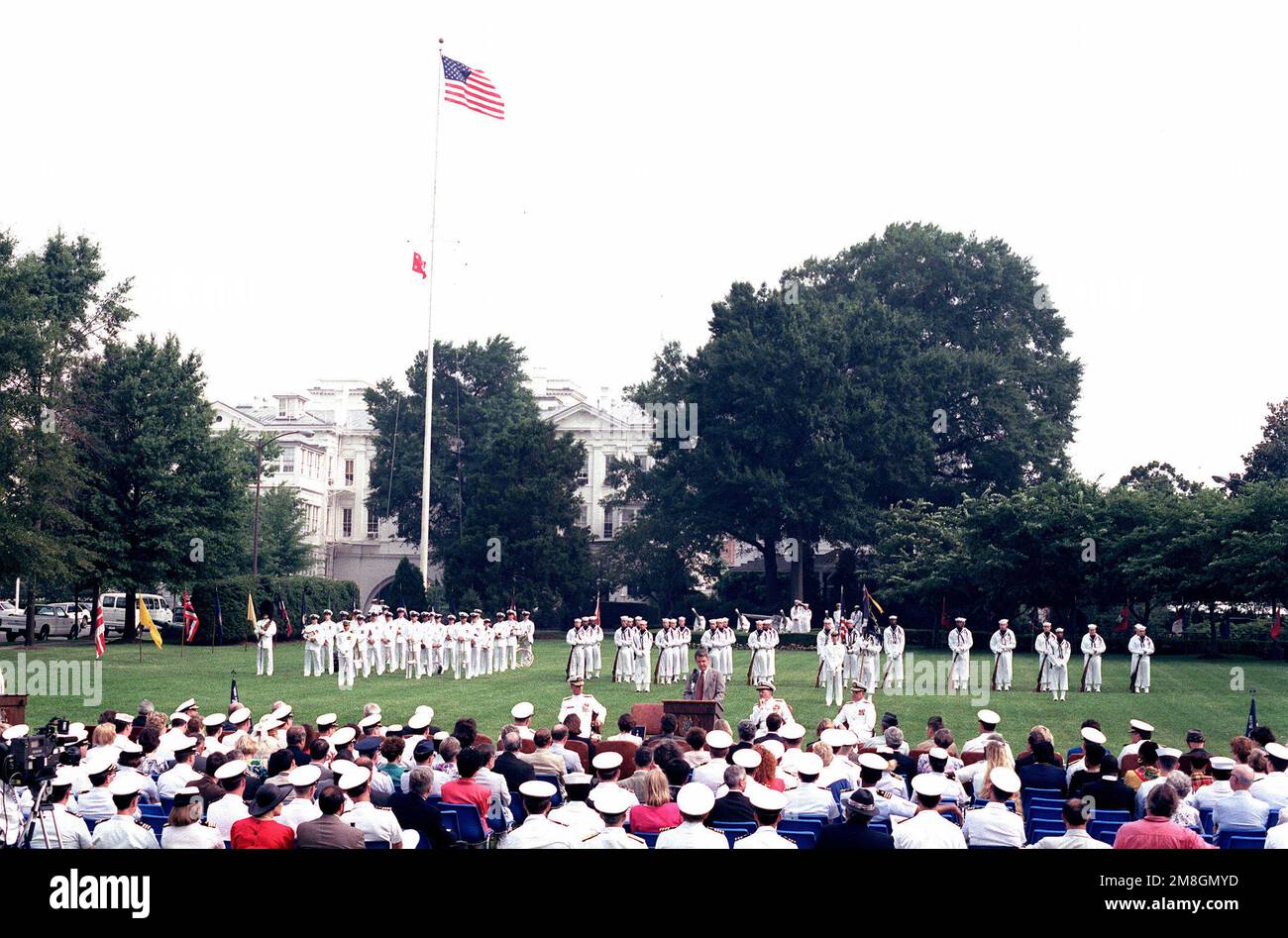 Under Secretary of the Navy J. Daniel Howard addresses the crowd assembled at the retirement ceremony held for RADM Brent Baker, chief of information, at the Washington Navy Yard. The Navy Ceremonial Guard is in the background. Base: Washington State: District Of Columbia(DC) Country: United States Of America (USA) Stock Photo