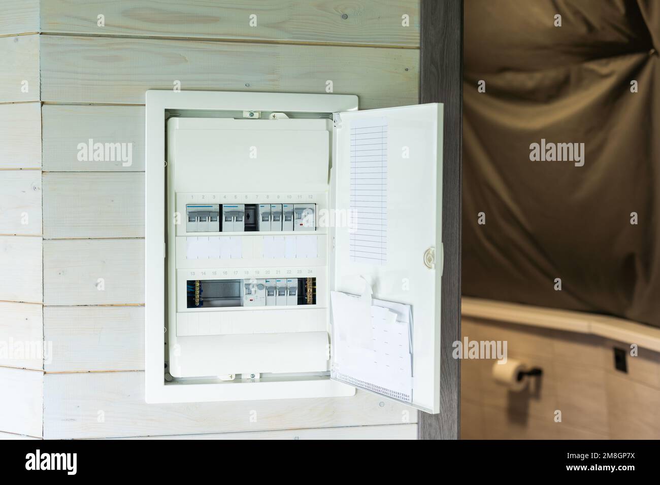 automatic fuses in electricity distribution box (fusebox) inside wooden