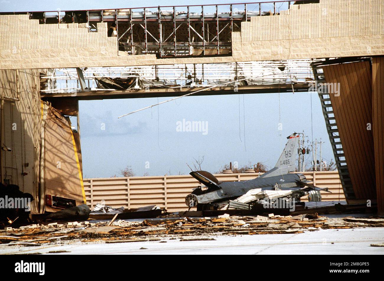 an-f-16-fighting-falcon-left-in-the-alert-complex-lay-destroyed-after-the-hangar-in-which-it-was-stored-was-destroyed-by-hurricane-andrew-subject-operationseries-hurricane-andrew-base-homestead-air-force-base-state-florida-fl-country-united-states-of-america-usa-2M8GPE5.jpg