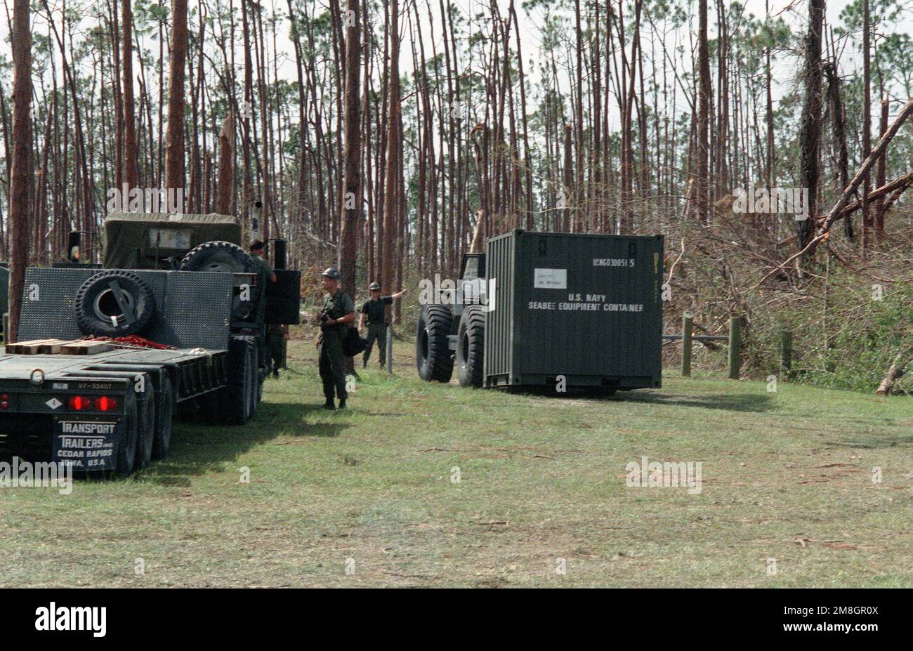 A member of a naval mobile construction battalion (Seabee) directs 
