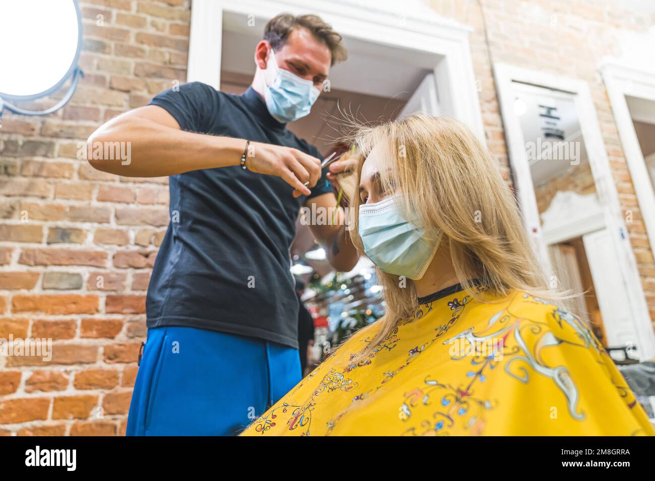 Girl blow drying hair hires stock photography and images Alamy