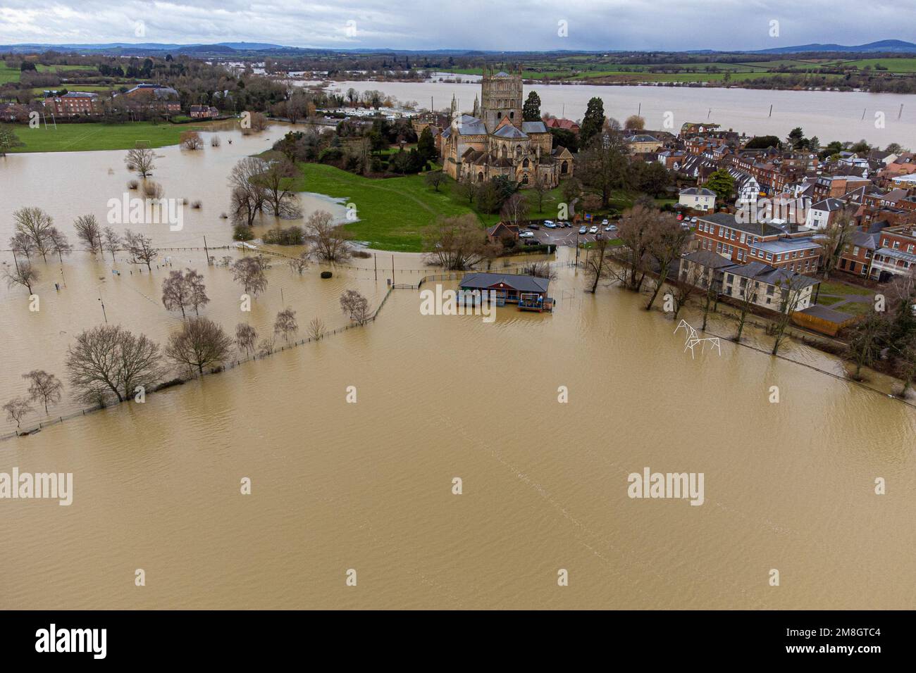 Flooding around Tewkesbury Abbey, in Gloucestershire. Heavy rain and blustery winds across much of the UK this weekend will be followed by a period of potentially severe cold weather next week. Picture date: Saturday January 14, 2023. Stock Photo