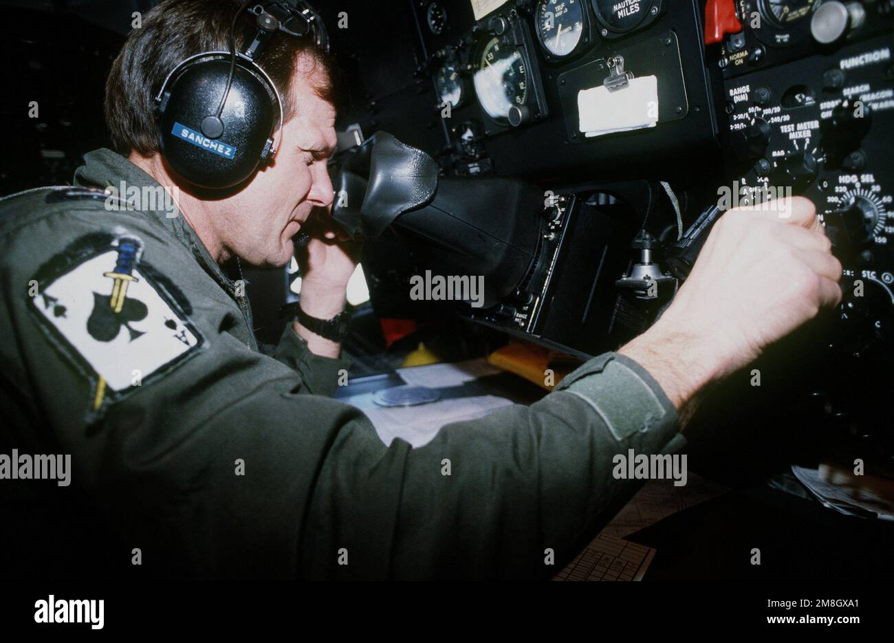 MAJ. Terry Sanchez, KC-135 navigator with the 434th Air Refueling Wing, AFRES, Grissom AFB, Indiana, guides his crew on an air refueling mission in support of the operation. Subject Operation/Series: RESTORE HOPE Base: Moron Country: Spain (ESP) Stock Photo