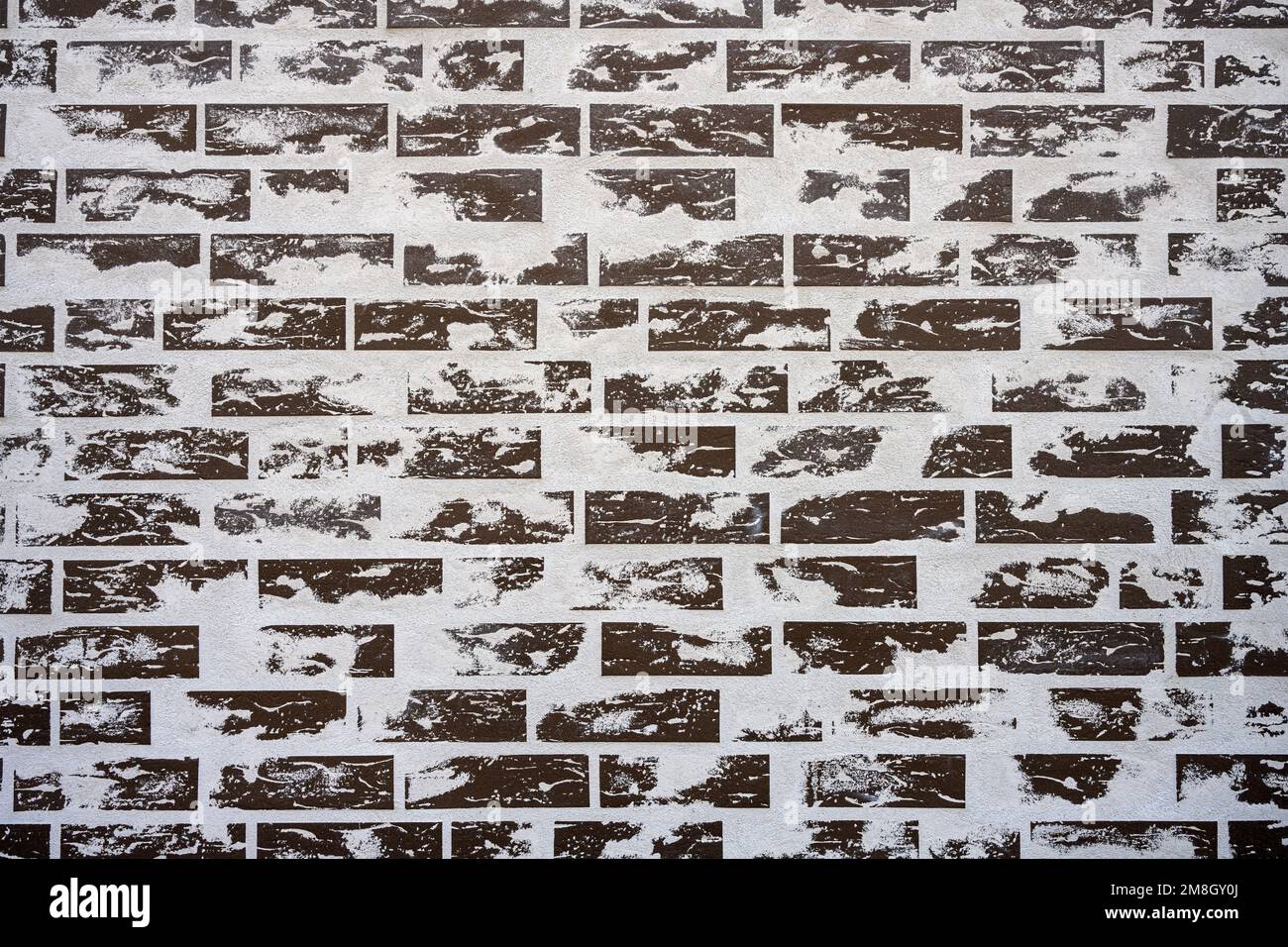 Background from a gray brick wall with cement residues Stock Photo