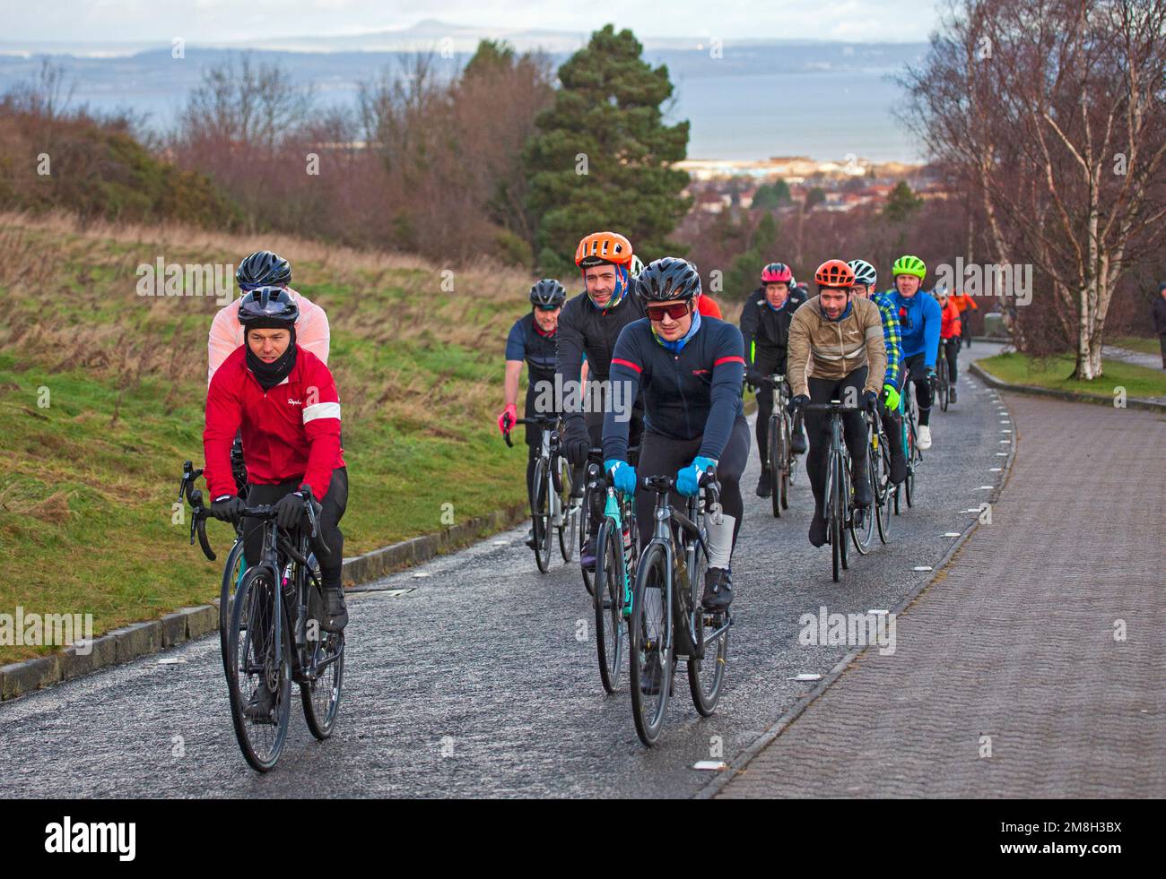 Mark Beaumont and friends at Arthurs Seat, Holyrood Park, Edinburgh, Scotland, for 10.30 this morning 14 January 2023 for some Doddie Aid laps, enduring rain, hail and a little sunshine at 4 degrees centigrade. Doddie Aid is a virtual mass-participation exercise event founded by former Scotland captain, Rob Wainwright, that lasts for 6 weeks from 1 January 2023.  In memory of the late Doddie Weir, raising funds for My Name'5 Doddie Foundation a charity committed to raising funds to fight Motor Neuron Disease. Credit: ArchWhite/alamy live news. Stock Photo