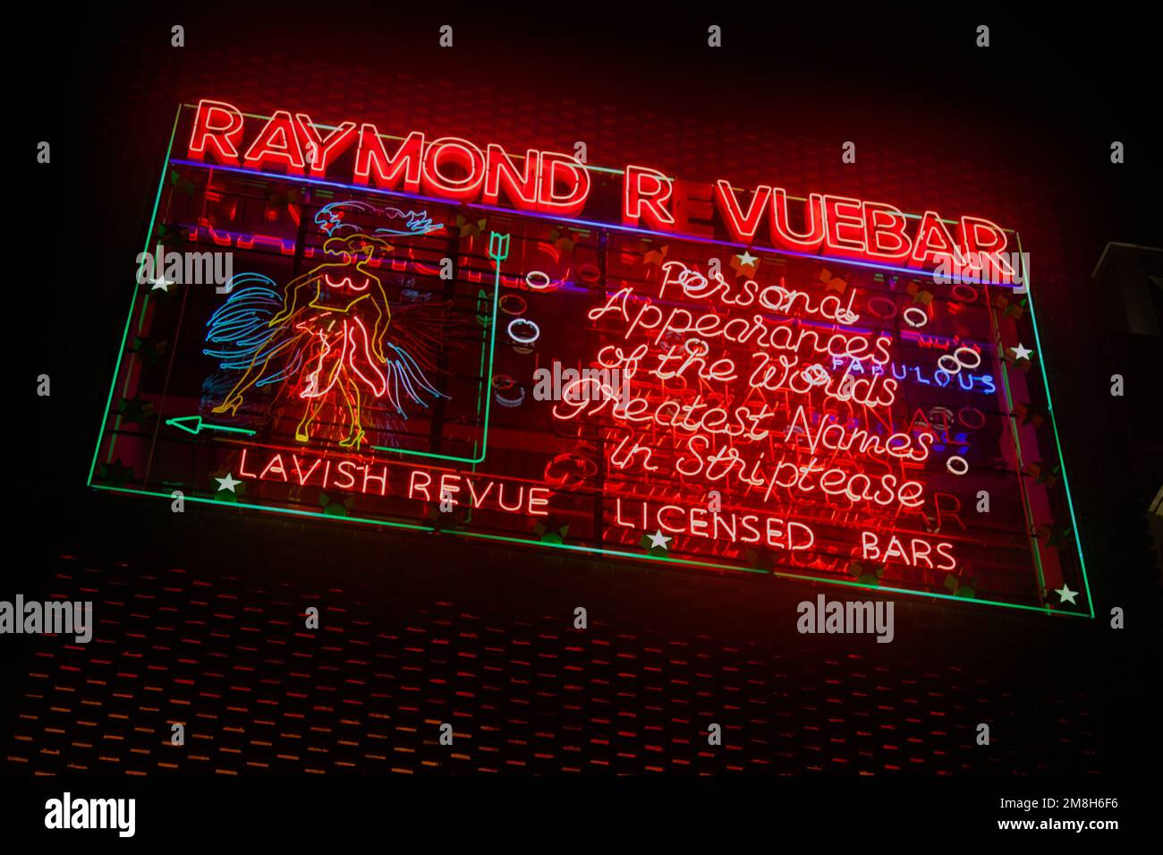 Neon Sign Advertising Striptease At The Raymond Revuebar, Soho London