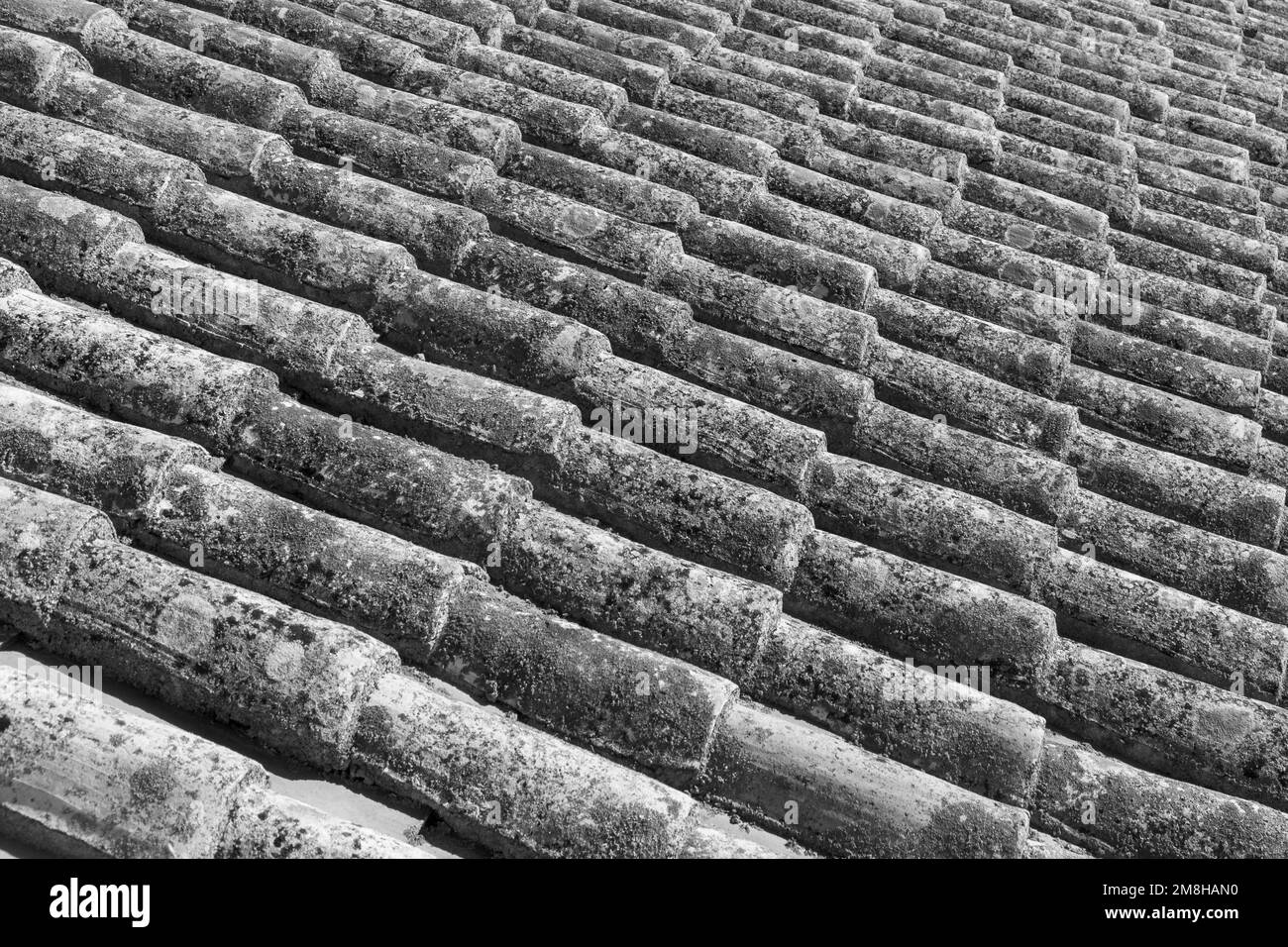 pattern of old red roof tiles gives a harmonic background Stock Photo