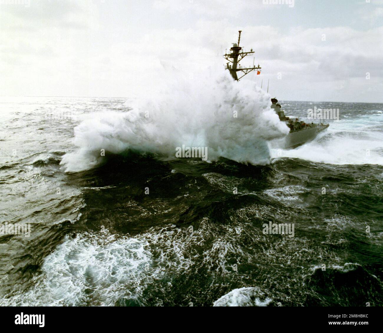 A port bow view of the guided missile destroyer USS ARLEIGH BURKE (DDG