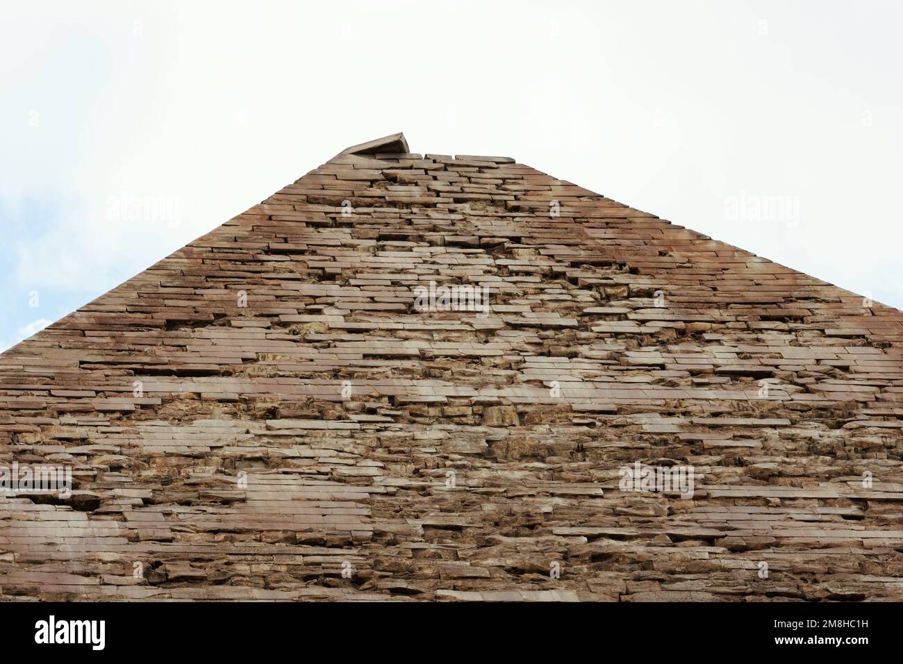 Tiled top of the pyramid of Khafre or of Chephren the second-tallest and second-largest of the 3 Ancient Egyptian Pyramids of Giza and the tomb of the Stock Photo