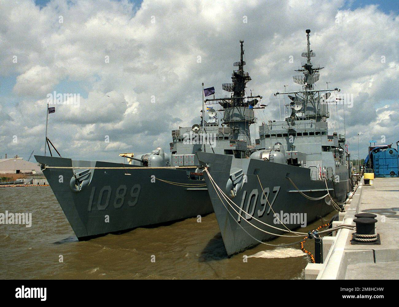 The frigate USS MOINESTER (FF-1097) and USS JESSE L. BROWN (FF-1089) are moored together at a pier at a Mobile shipyard. Base: Mobile State: Alabama (AL) Country: United States Of America (USA) Stock Photo