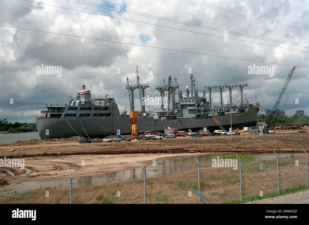 The cargo ship BUYER (TAK-2033) stands moored to a pier at a Mobile shipyard. Base: Mobile State: Alabama (AL) Country: United States Of America (USA) Stock Photo