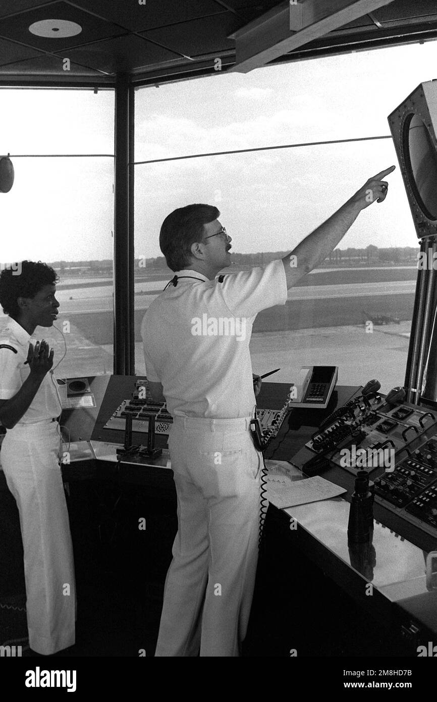 Air traffic controllers monitor operations in the control tower at