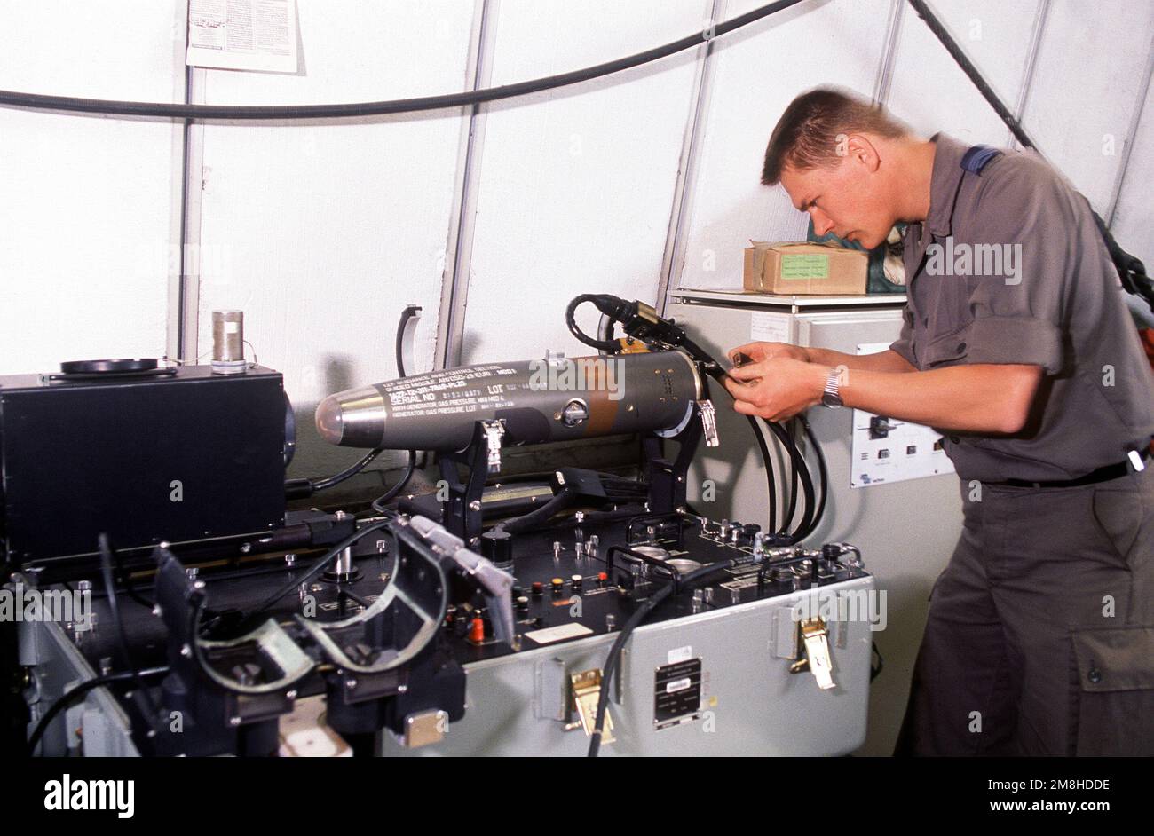 An armament technician of the Dutch air force repairs the guidance system of an AIM-9 Sidewinder missile during Operation Deny Flight, the enforcement of the United Nations-sanctioned no-fly zone over Bosnia and Herzegovina. Subject Operation/Series: DENY FLIGHT Base: Villafranca Air Base Country: Italy (ITA) Stock Photo