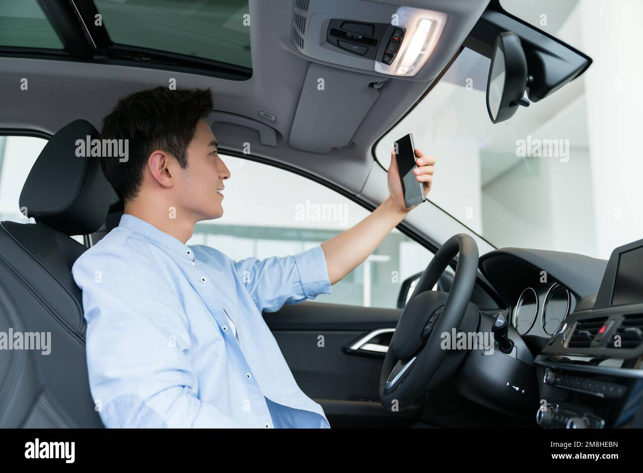 A young business man in the car Stock Photo - Alamy