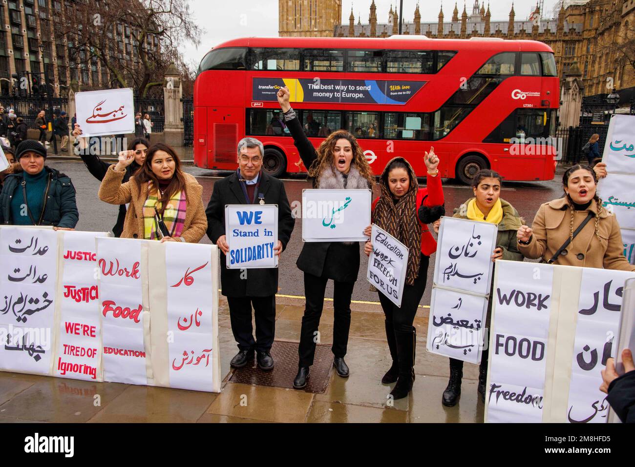 London, UK. 14th Jan, 2023. A group of Afghan people protest outside Parilament and demand the right to education, freedom, justice and food. They want freedom for Afghan women and a basic right to education. Credit: Mark Thomas/Alamy Live News Stock Photo