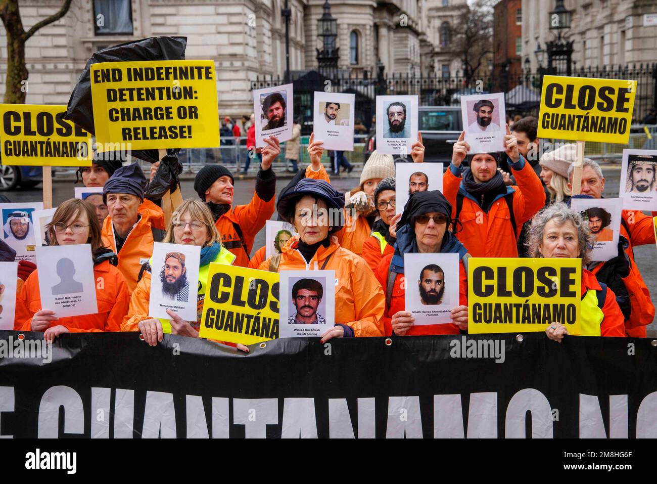 London, UK. 14th Jan, 2023. Protestors march through Westminster and stop outside Downing Street. They are asking for the closure of Guantanemo prison which has been operating for over 21 years. The groups inckluding Amnesty International and the Guantanemo Justice Campaign are asking President Biden to close the prison on the island of Cuba. Credit: Mark Thomas/Alamy Live News Stock Photo