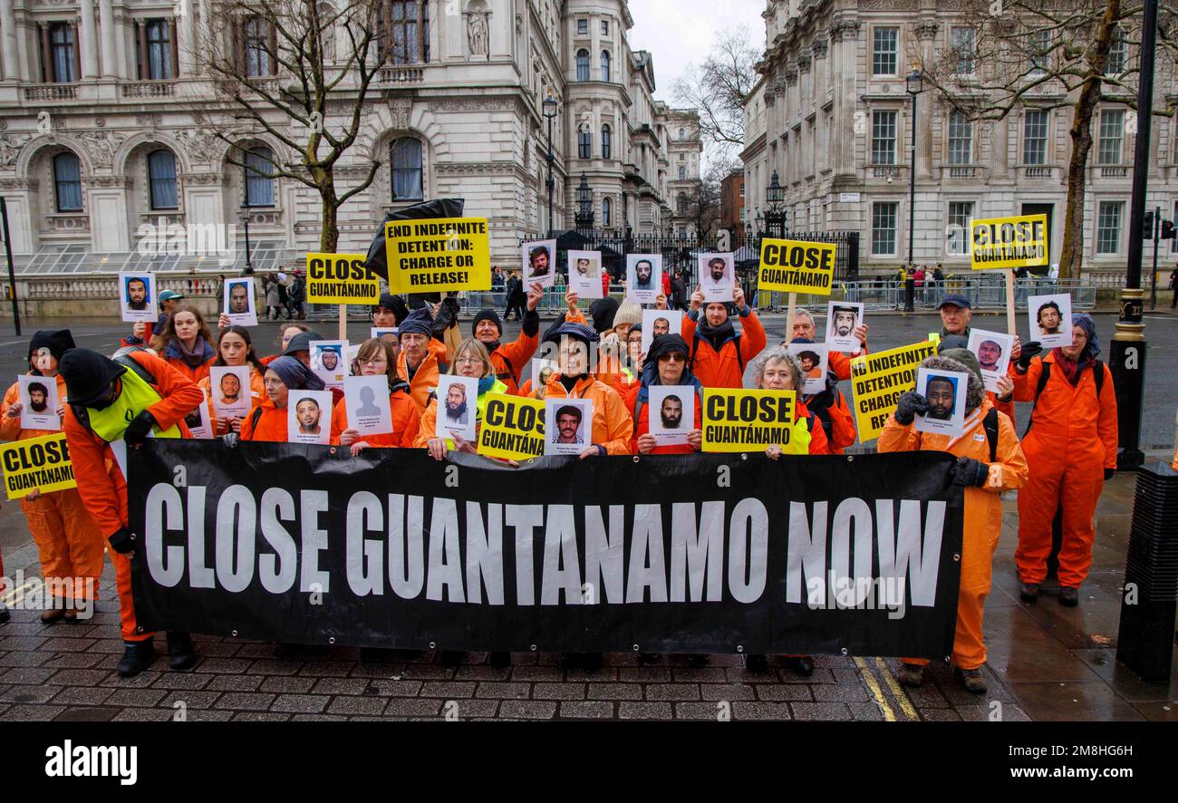 London, UK. 14th Jan, 2023. Protestors march through Westminster and stop outside Downing Street. They are asking for the closure of Guantanemo prison which has been operating for over 21 years. The groups inckluding Amnesty International and the Guantanemo Justice Campaign are asking President Biden to close the prison on the island of Cuba. Credit: Mark Thomas/Alamy Live News Stock Photo