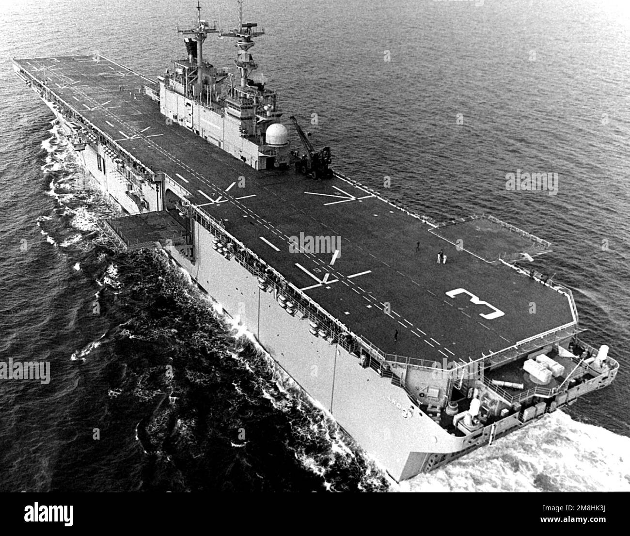 An elevated port quarter view of the amphibious assault ship USS 