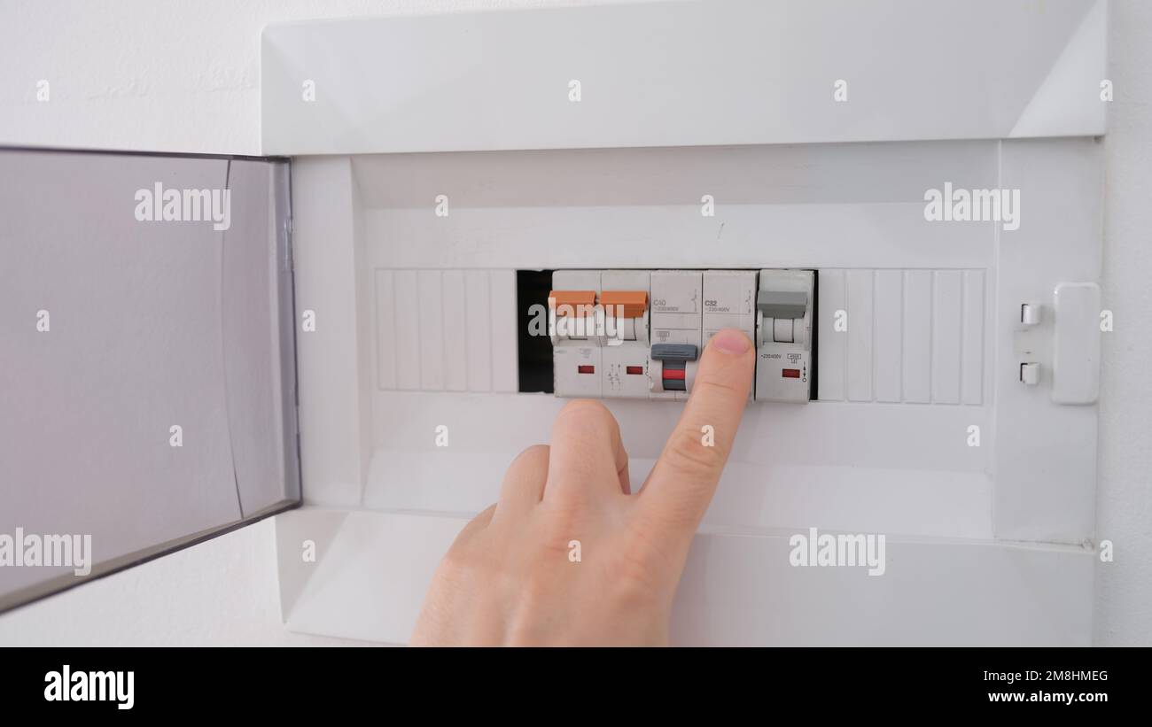 Turning on circuit breaker on control panel after it tripped due to