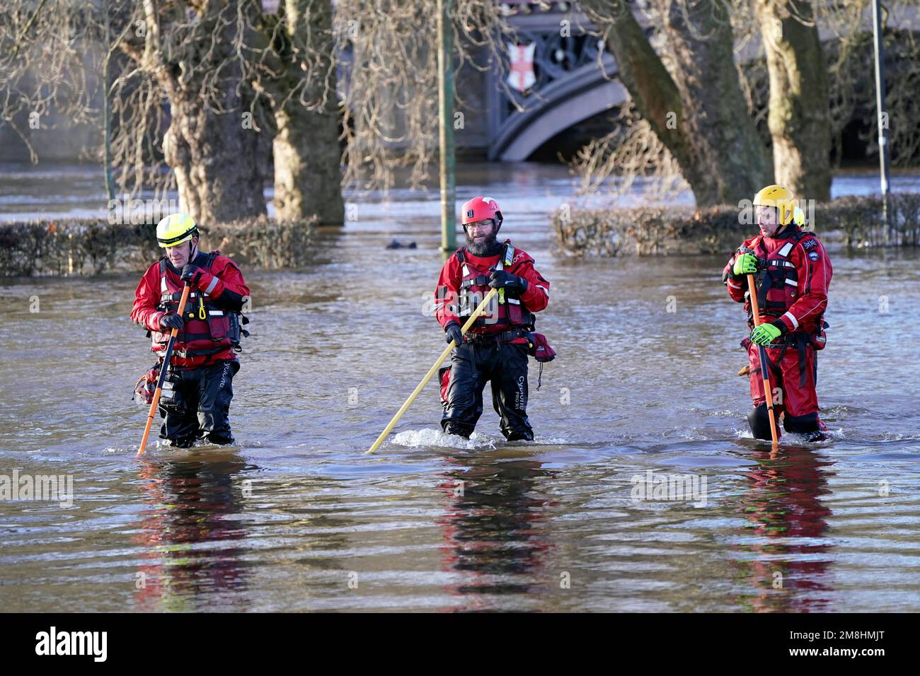 Rescue workers wade through floodwater in the centre of York after