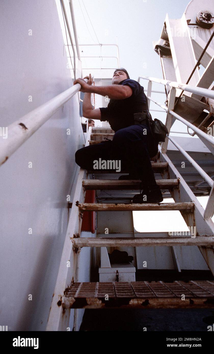 A member of the guided missile cruiser USS NORMANDY's (CG-60) boarding ...