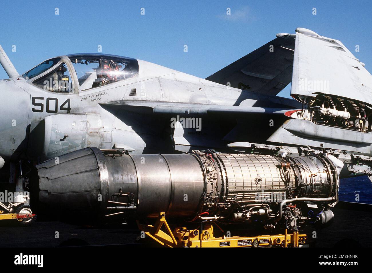 A Pratt & Whitney J-52-P-8B turbojet engine rest on a engine ...