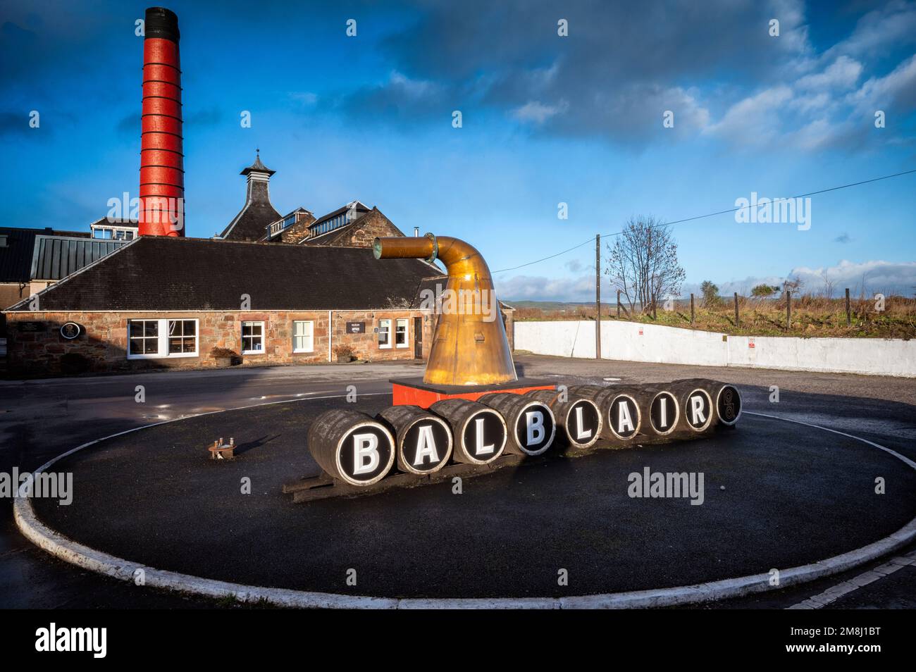 I stumbled upon Balblair Distillery on my travels, the old buildings reflected the warm tones of the winter sunlight nicely. Stock Photo