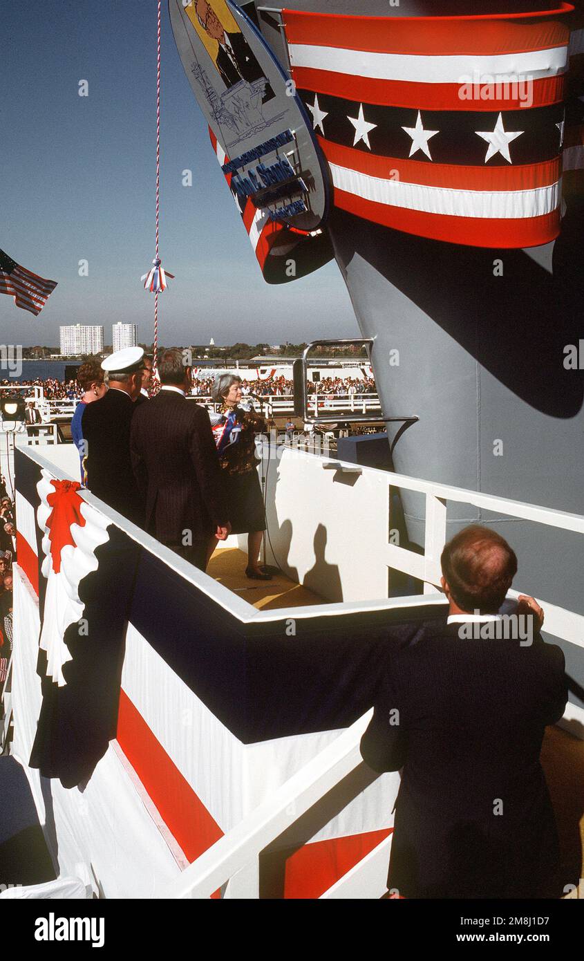 With the words, 'I christen thee United States Ship John C. Stennis,' Mrs. Margaret Stennis Womble, daughter of the ships's namesake, formally christened the Nimitz class nuclear-powered aircraft carrier John C. Stennis (CVN-74) at the Newport News Ship Building and Dry Dock Corporation. She is shown here swinging the traditional bottle of champagne toward the prow of the ship. Base: Newport News State: Virginia (VA) Country: United States Of America (USA) Stock Photo
