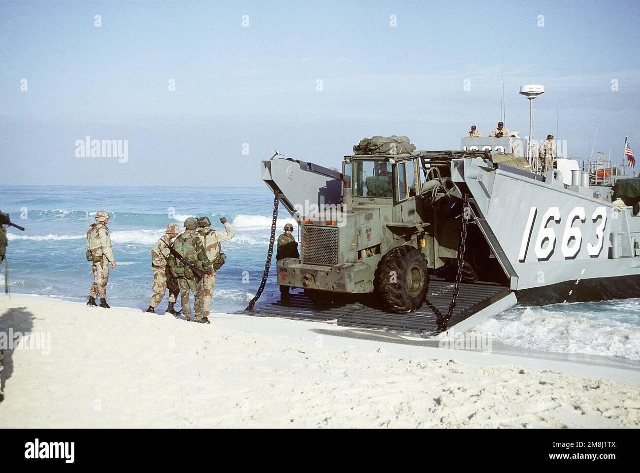 Members of the US Navy Amphibious Construction Battalion 2, off-load a rough terrain forklift from a utility landing craft. Subject Operation/Series: Bright Star 94 Country: Egypt (EGY) Stock Photo
