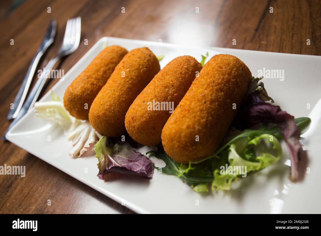 Spanish croquettes. The croquette is a portion of dough made from a