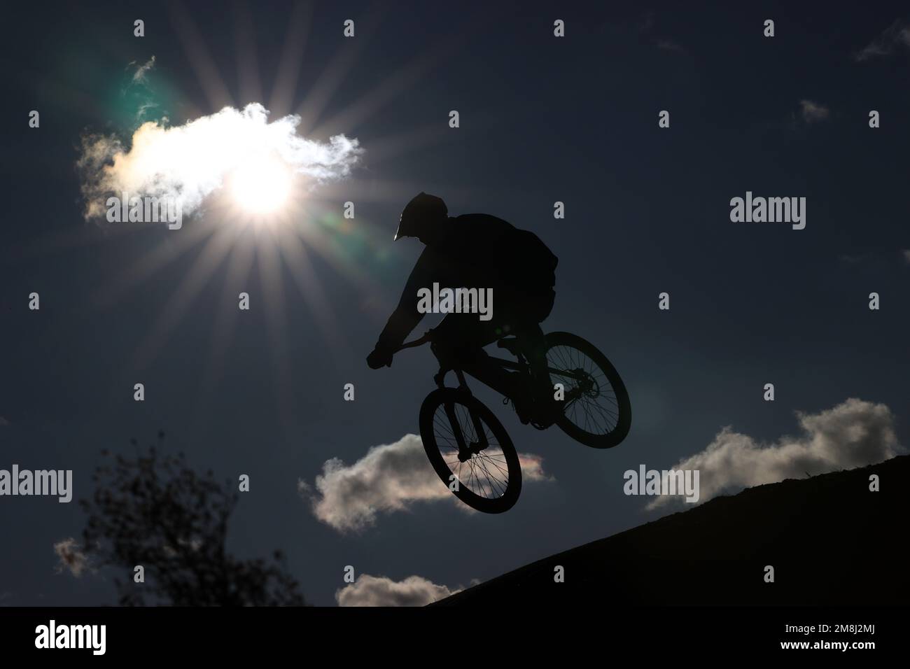 Mountain bike riders in action at a BMX and pump track near Fleet in Hampshire Stock Photo Alamy