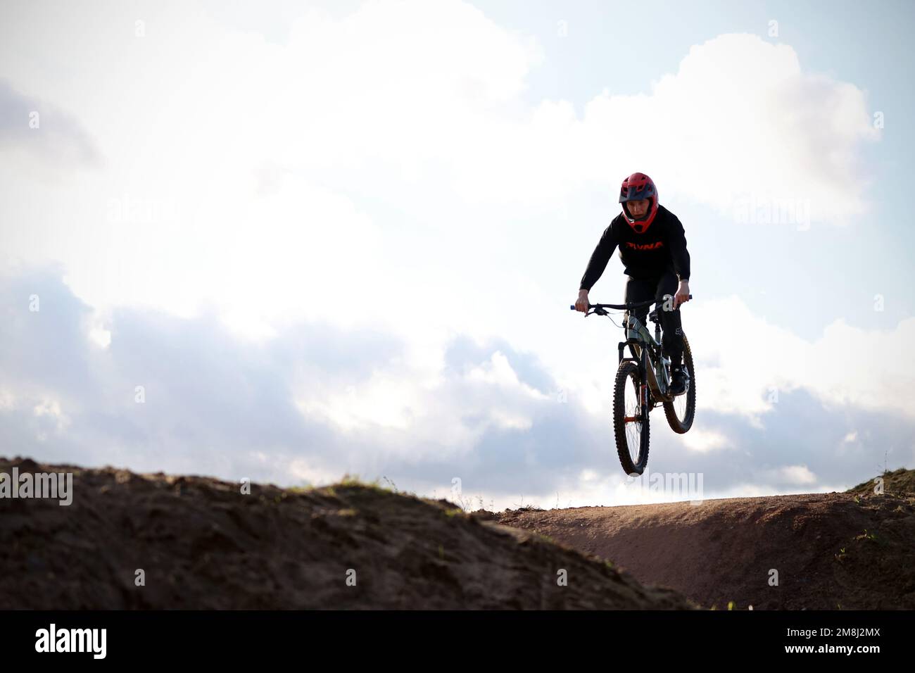 Mountain bike riders in action at a BMX and pump track near Fleet in Hampshire Stock Photo Alamy