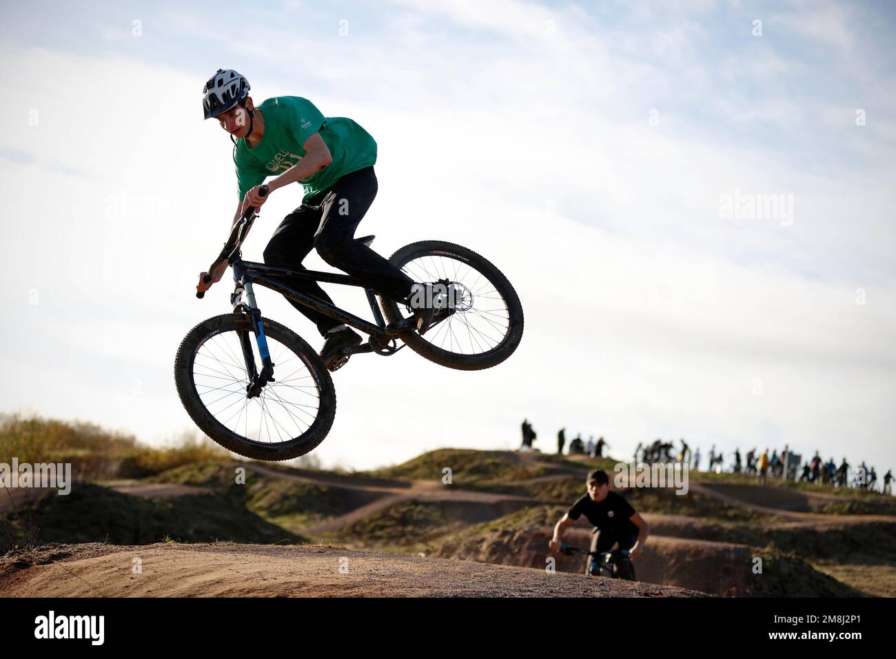 Mountain bike riders in action at a BMX and pump track near Fleet in Hampshire Stock Photo Alamy